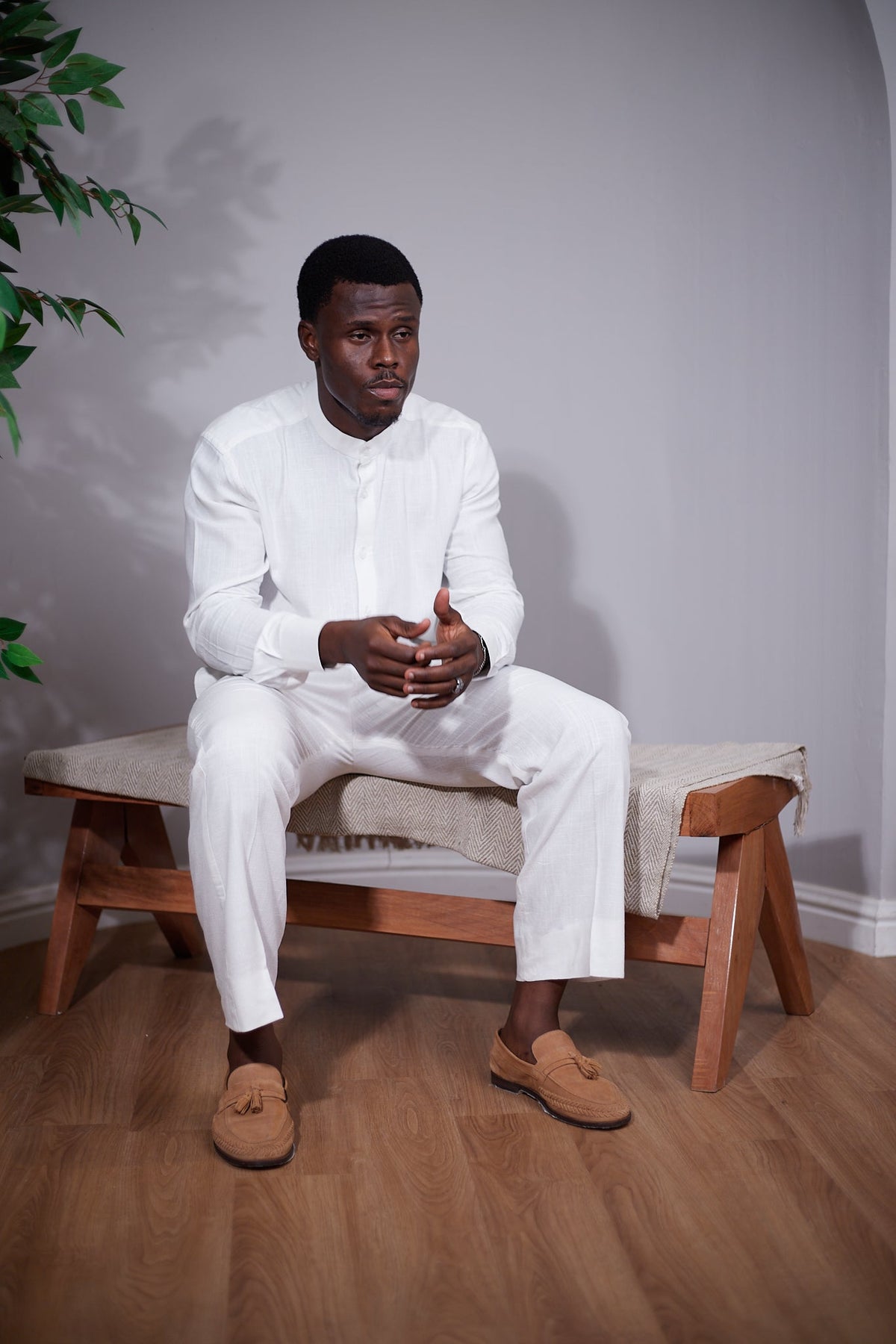Orí Adé white mandarin-collar linen shirt and matching drawstring trousers — side view