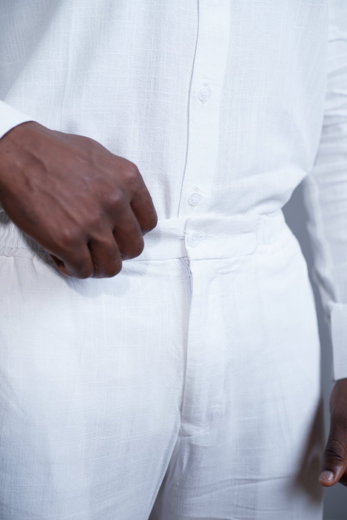 Orí Adé white mandarin-collar linen shirt and matching drawstring trousers — styling view