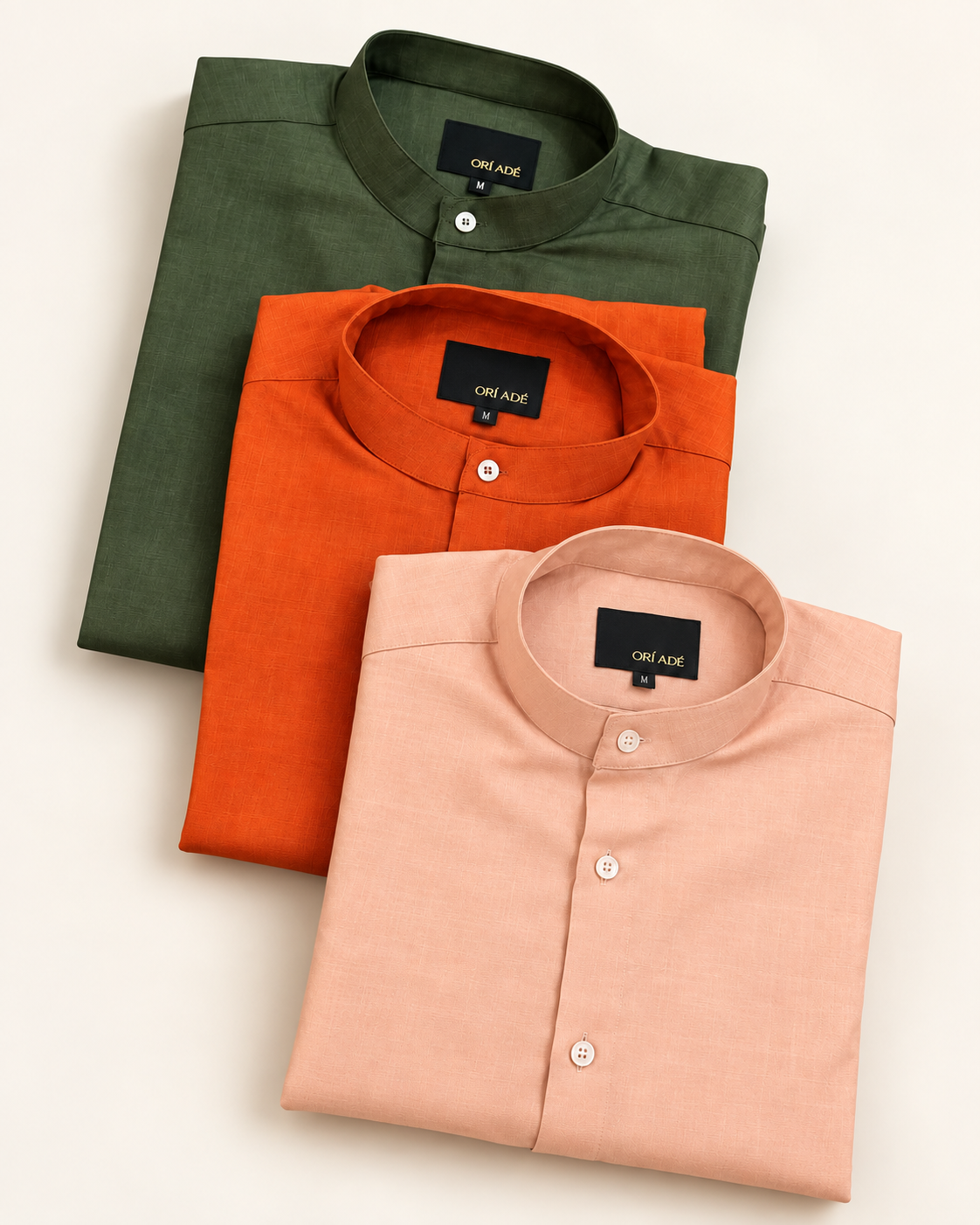 Olive green, terracotta and peach Orí Adé linen grandad shirts photographed together