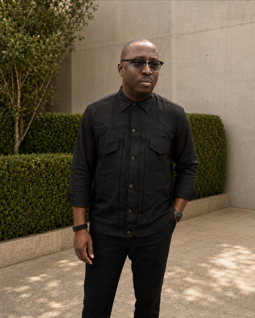 Orí Adé Black Pleated Utility Set worn with matching black trousers